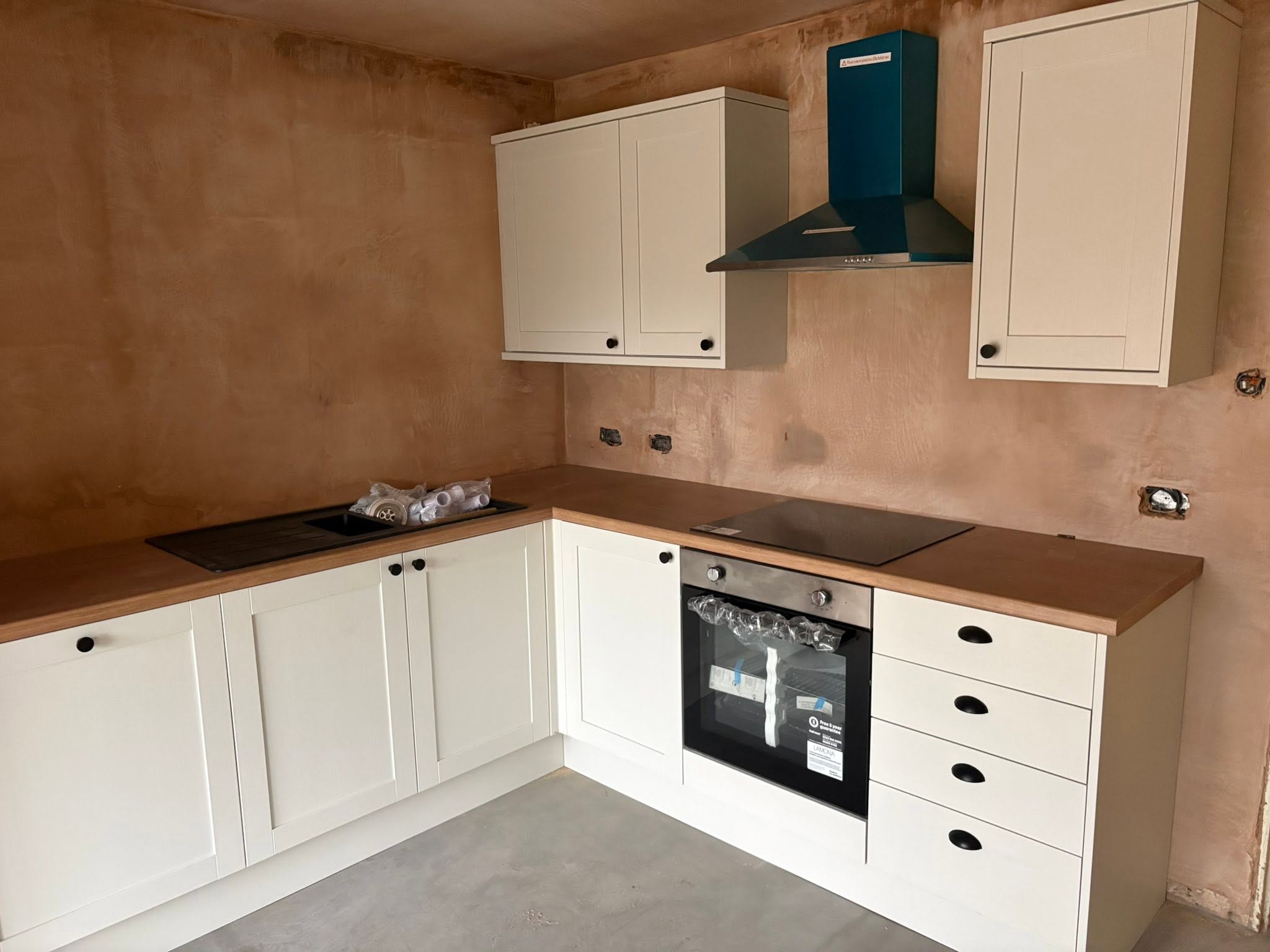 Cream shaker kitchen with oak worktop