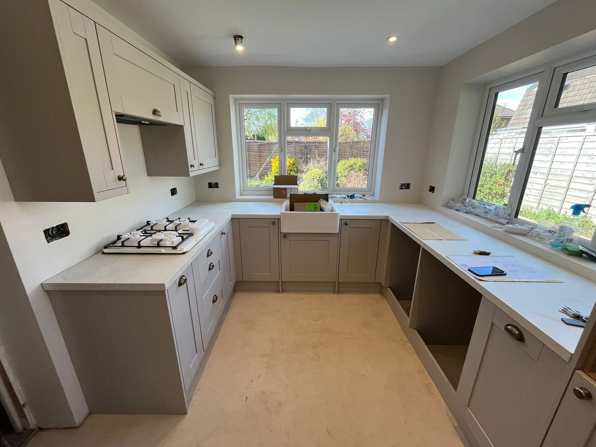 Cream shaker kitchen with butler sink under window